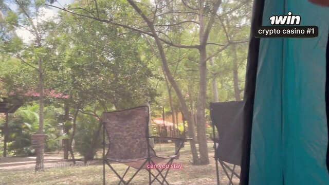 Ariel Siren relaxes outdoors in chairs during camping vlog