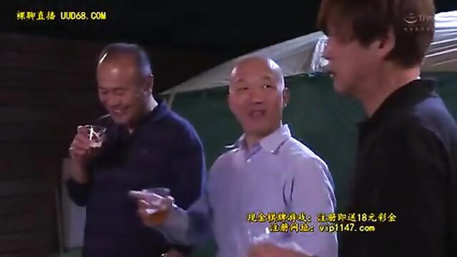 Three Asian men drinking whiskey outdoors, smiling casually