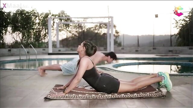 Indian aunty in tight shorts doing yoga by pool with fit guy
