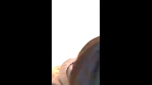 Asian woman closeup teasing with tongue out and nude breasts exposed