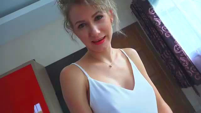Angel The Dreamgirl in tight white slip dress, teasing cleavage closeup