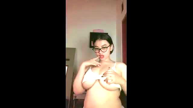 Dara Barbar Asian beauty teasing huge tits in white bra closeup