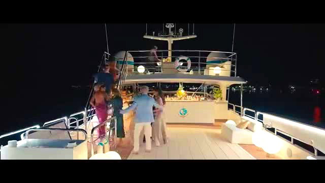 Sydney Sweeney in sexy dress on luxury yacht party at night