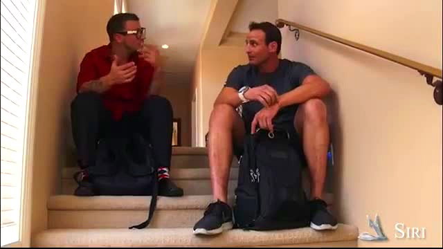 Siri Pornstar and Mr. Pete chatting on stairs in casual clothes
