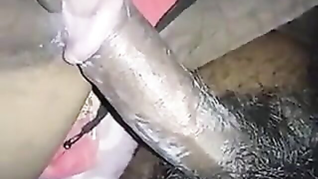 Amateur closeup of cock wrapped in condom thrusting into tight hole