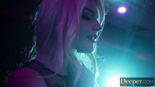 Blonde bombshell Kenna James in neon-lit strip club booth