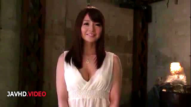 Saya in white dress smiles seductively in JAV scene