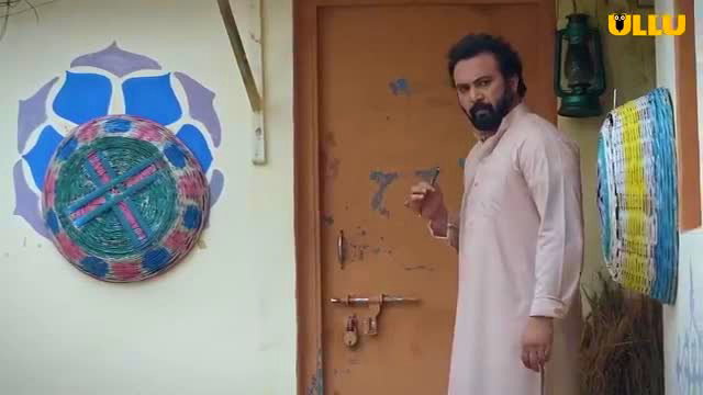 Handsome bearded Indian man in white kurta at village door, Ullu adult series