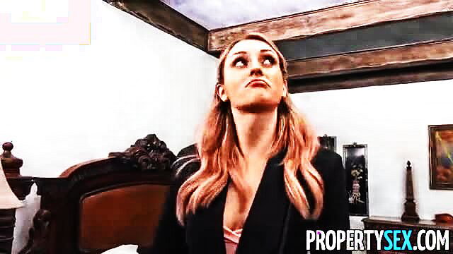 Blonde in suit looks up seductively in Property Sex divorce fuck scene