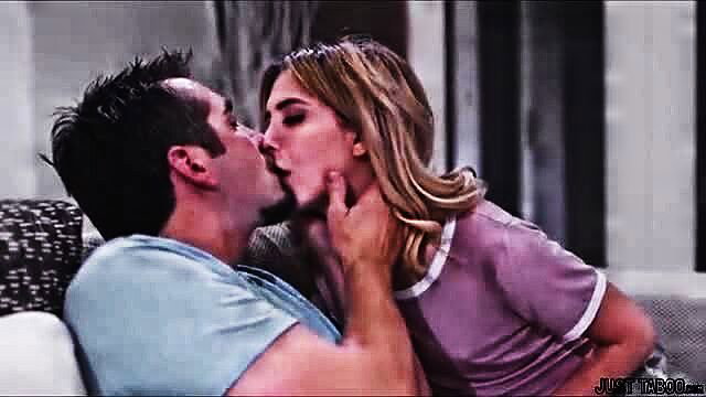 Hot blonde grabs man's face for deep taboo kiss on couch