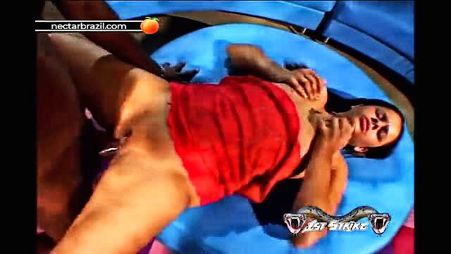 Latina woman in red dress spreads legs wide exposing pussy on blue float