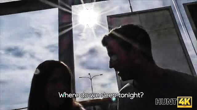 Silhouette couple by window asks where do we sleep tonight? Hunt4K