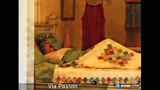Via Paxton asleep in bed under colorful quilt, SCORE Classics