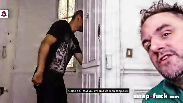 Two tattooed men in bathroom, one pulling down pants teasing snap-fuck