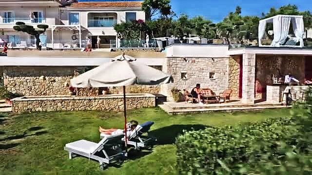 Sonya Blaze and Lika Star lounging poolside with Alberto Blanco at Vixen villa