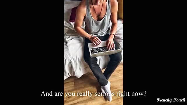 FrenchyTouch muscular guy in tank top and socks on bed with laptop