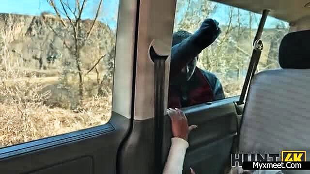 Blonde white girl sucks big black cock from car door in outdoor amateur scene