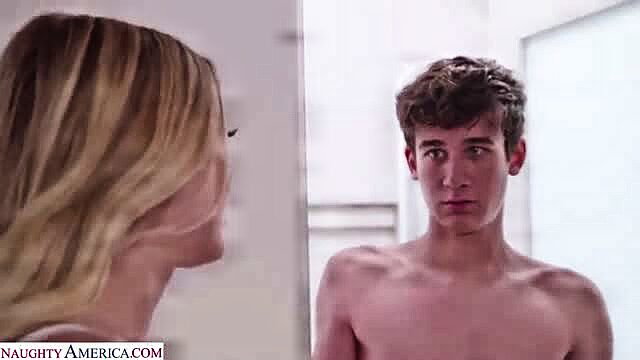 Blonde babe stares at nude teen guy in bathroom seduction scene