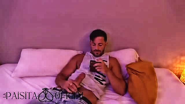 La Paisita Oficial stroking cock on bed in tank top