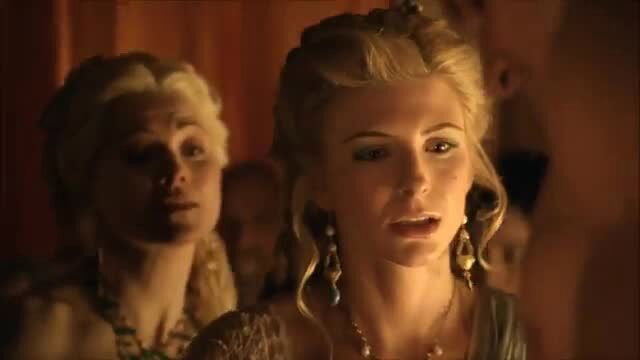 Blonde women in elegant ancient gowns, close-up erotic tension