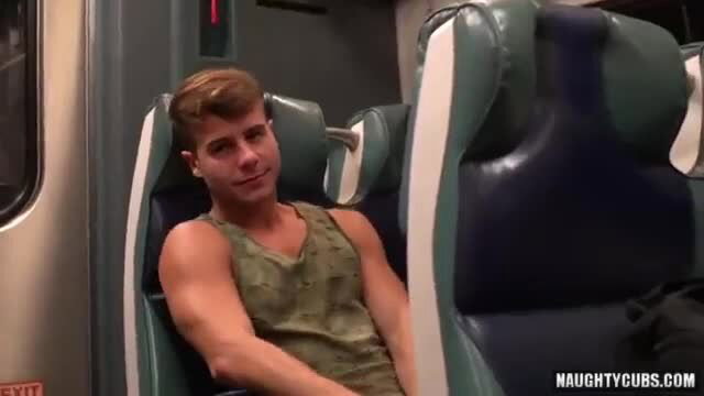 Muscular white twink in tank top with huge boner on train