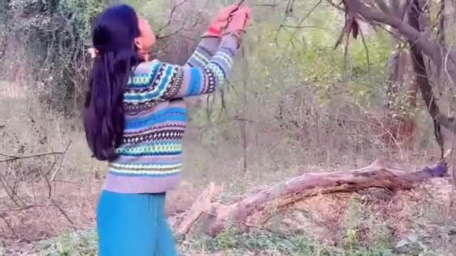 Priya Indian girl in sweater picking from tree, big ass view