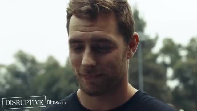Handsome hunk with short brown hair looks intense outdoors