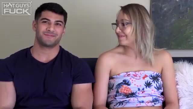 Handsome stud with pretty blonde girl on couch, teasing smiles