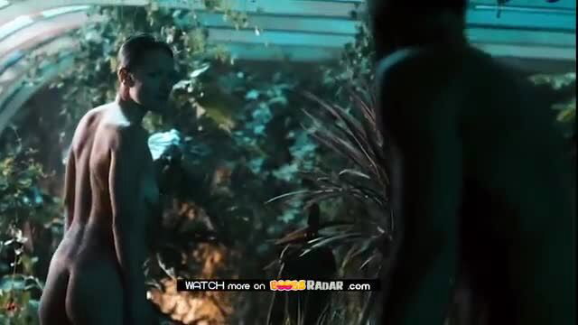 Emma Wild nude sensual couple scene in lush garden