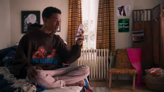 Madison Pettis in hoodie taking selfie in bedroom