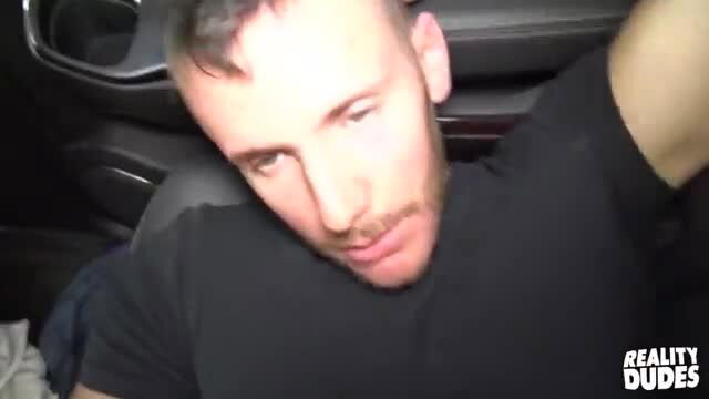 Hunky white guy with buzzcut beard in car blowjob scene
