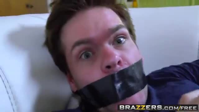 Gagged man with wide eyes on couch in Brazzers cheating wife scene