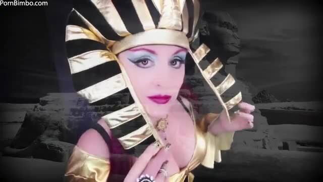Jade Paris as sexy Egyptian queen in gold costume, cleavage tease