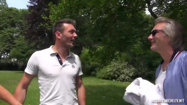 Two mature men chatting outdoors in park, gay teaser thumbnail