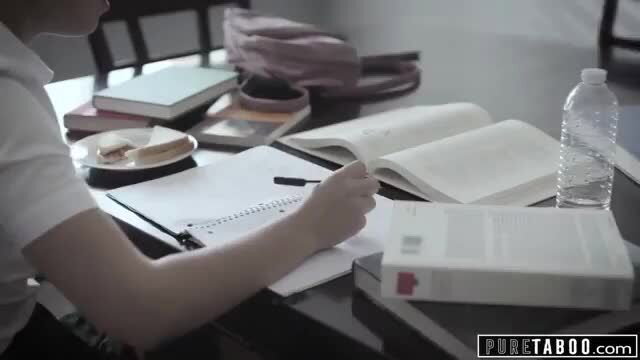 Alina Lopez Latina teen student writing at desk in uniform