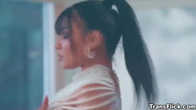 Eva Maxim in pearl lingerie with ponytail, side profile gaze