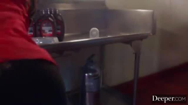 Lucky Fate in red top black leggings at kitchen sink, curvaceous brunette tease