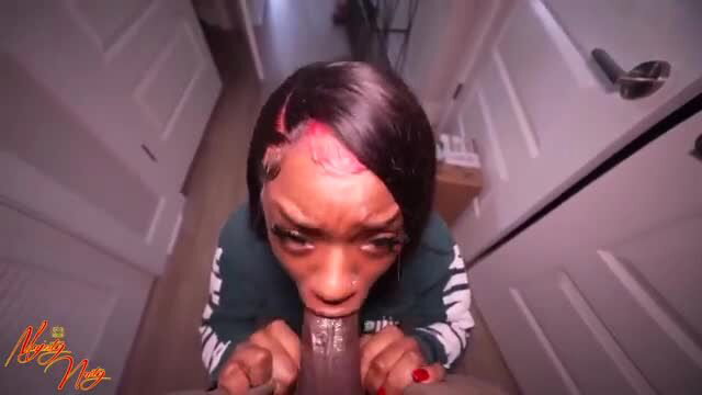 Black woman with red hair in intense close-up oral sex action