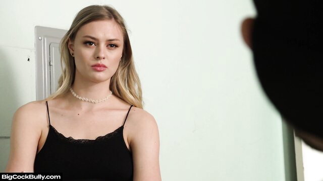 Amber Moore in black lace top, seductive pose in Sister Rides Big Bully Cock