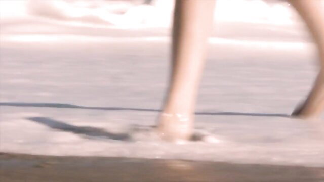 Lena Anderson's long sexy legs walking on beach in wet swimsuit