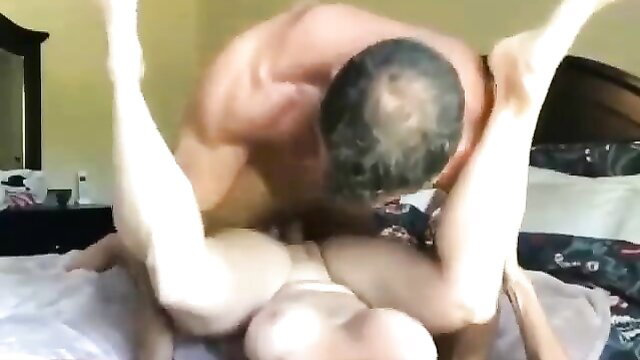 Muscular man fucking gorgeous woman in missionary with legs up