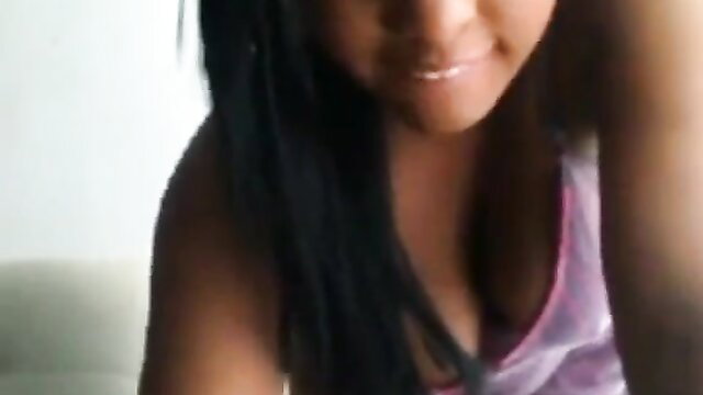 Asian teen in tight pink tank top, deep cleavage closeup