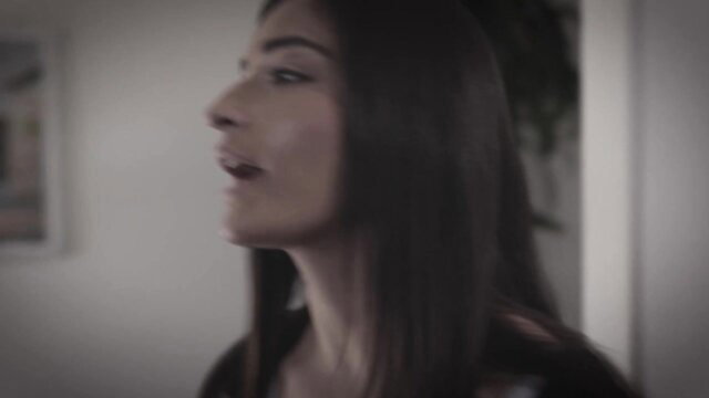 Emily Willis profile view singing in seductive pose