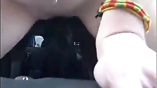 Woman riding gear shift and sucking cock in car POV
