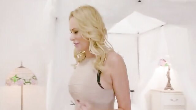 Brandi Love in sexy beige dress, blonde bombshell pose