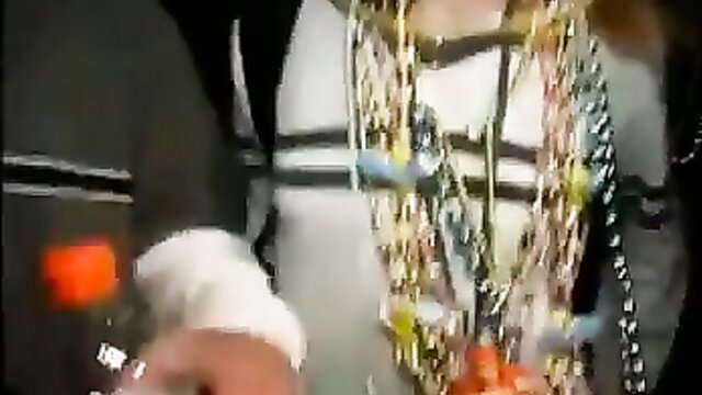 Mardi Gras Fantasy Fest beaded woman in revealing outfit closeup