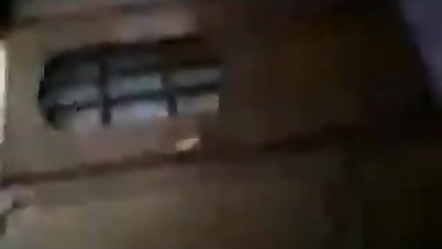 Albanian amateur wife teases through barred window in sheer top