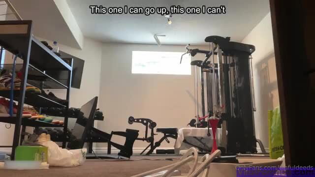 Gym room with weights and machines, one light works one doesn't