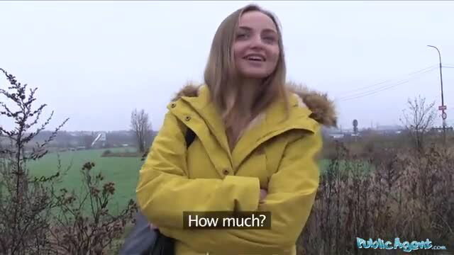 Blonde in yellow parka smiles outdoors asking how much for sex