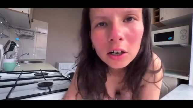 Busty stepmom POV closeup in kitchen, flushed face and cleavage tease